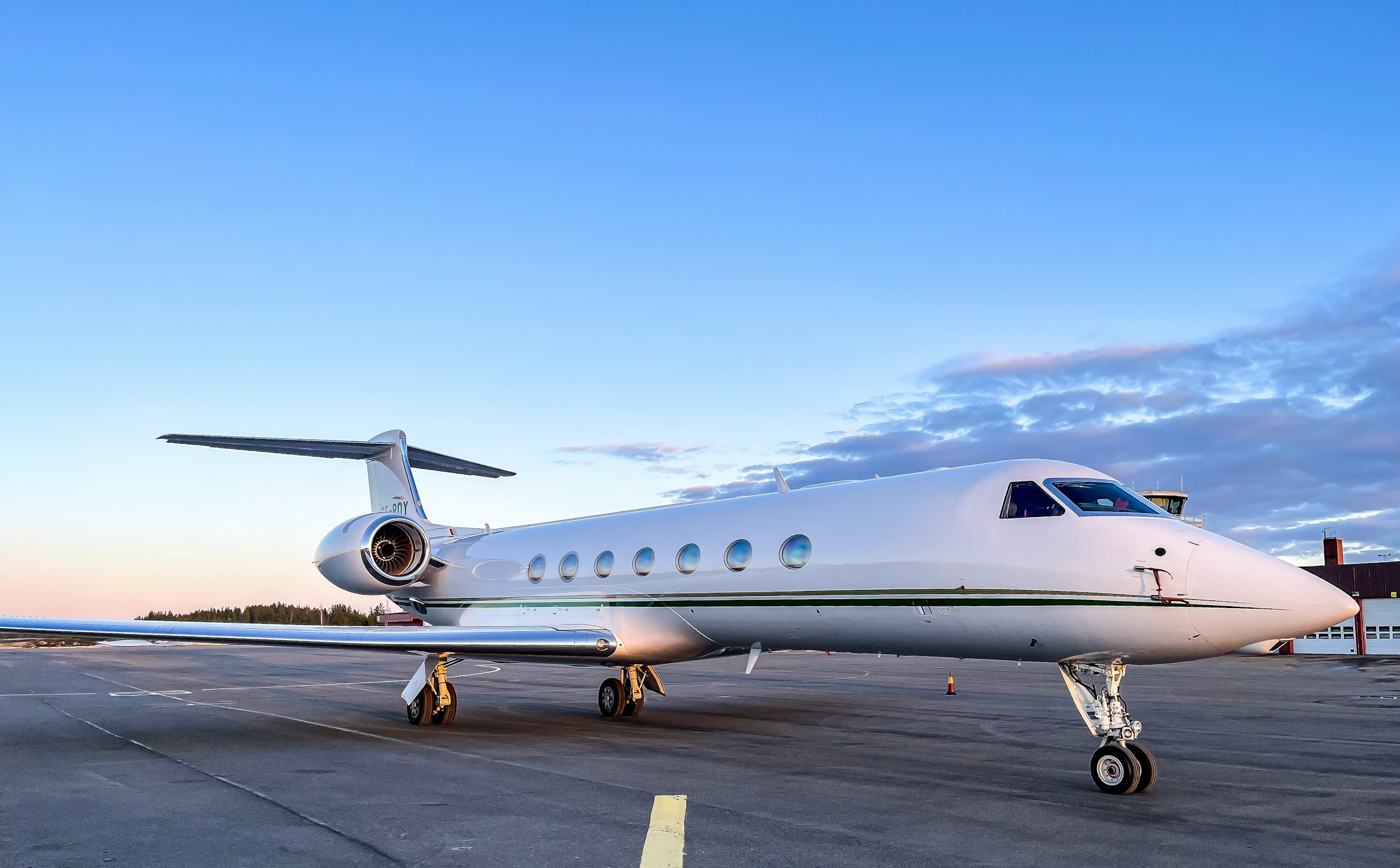 Private jet on the tarmac at dusk